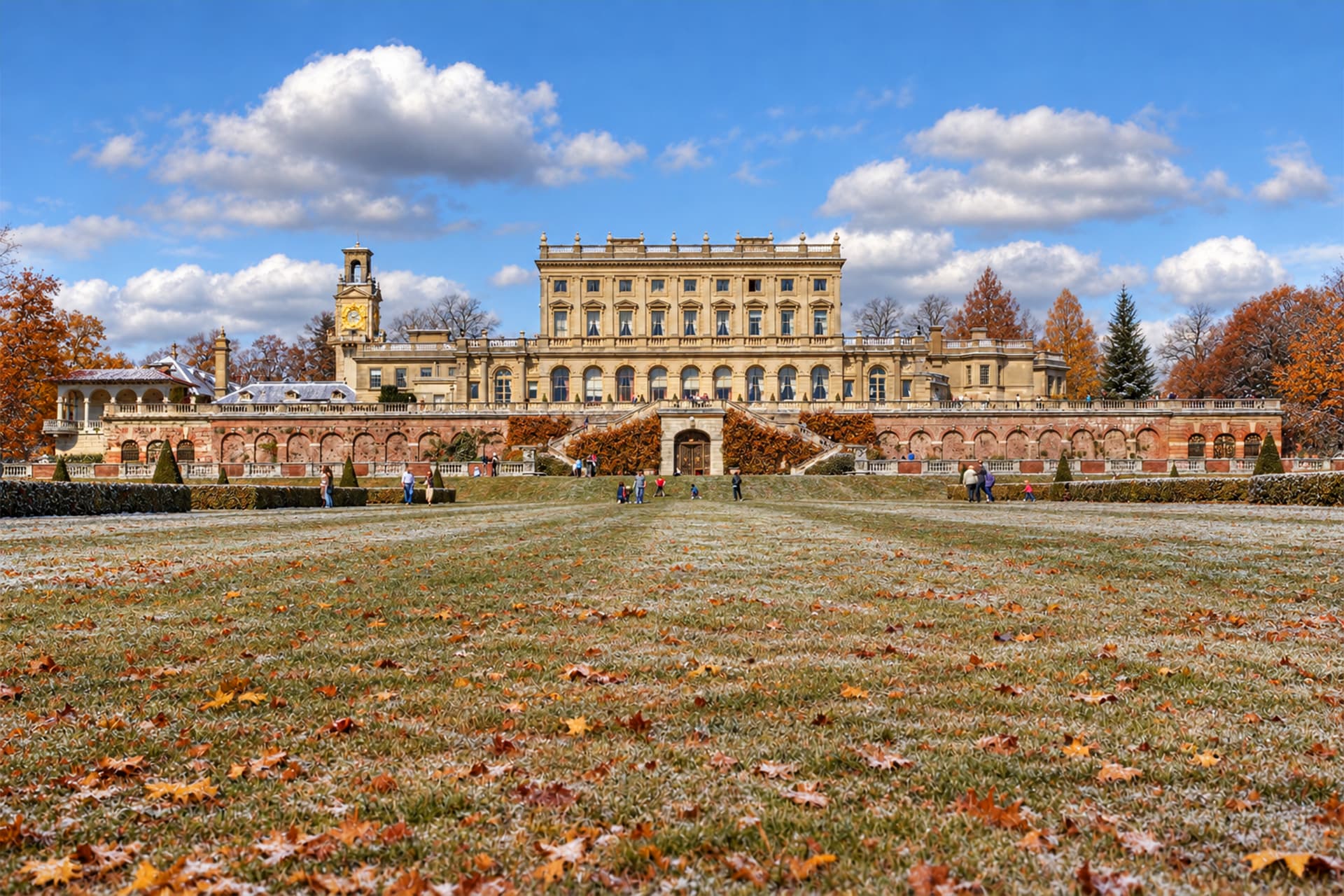 A large building behind a green field